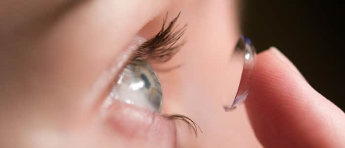 contact lens being put in eye